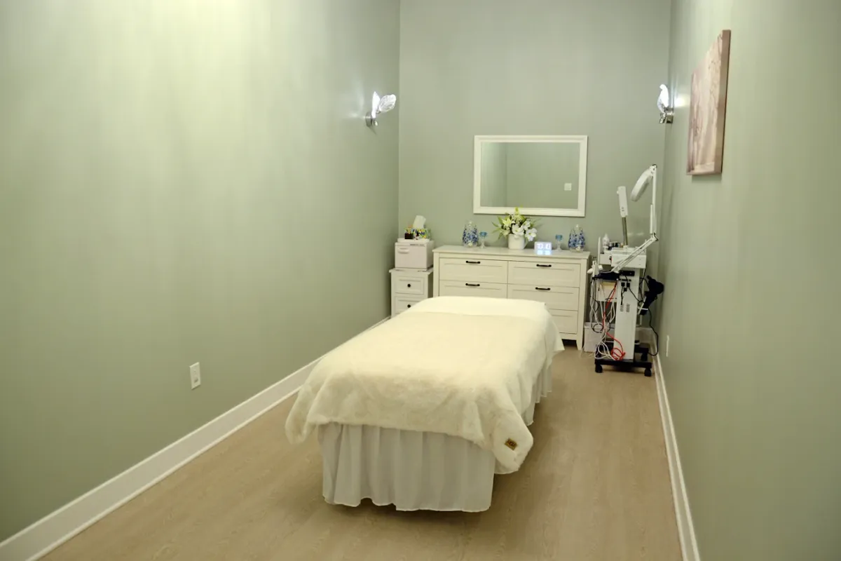 The facial room at May Breeze Spa with a lit mirror and product trolley